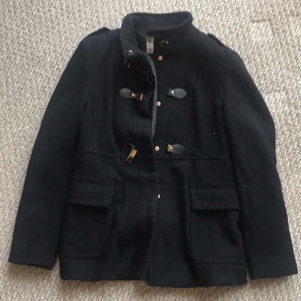 Black winter coat with gold buttons clips